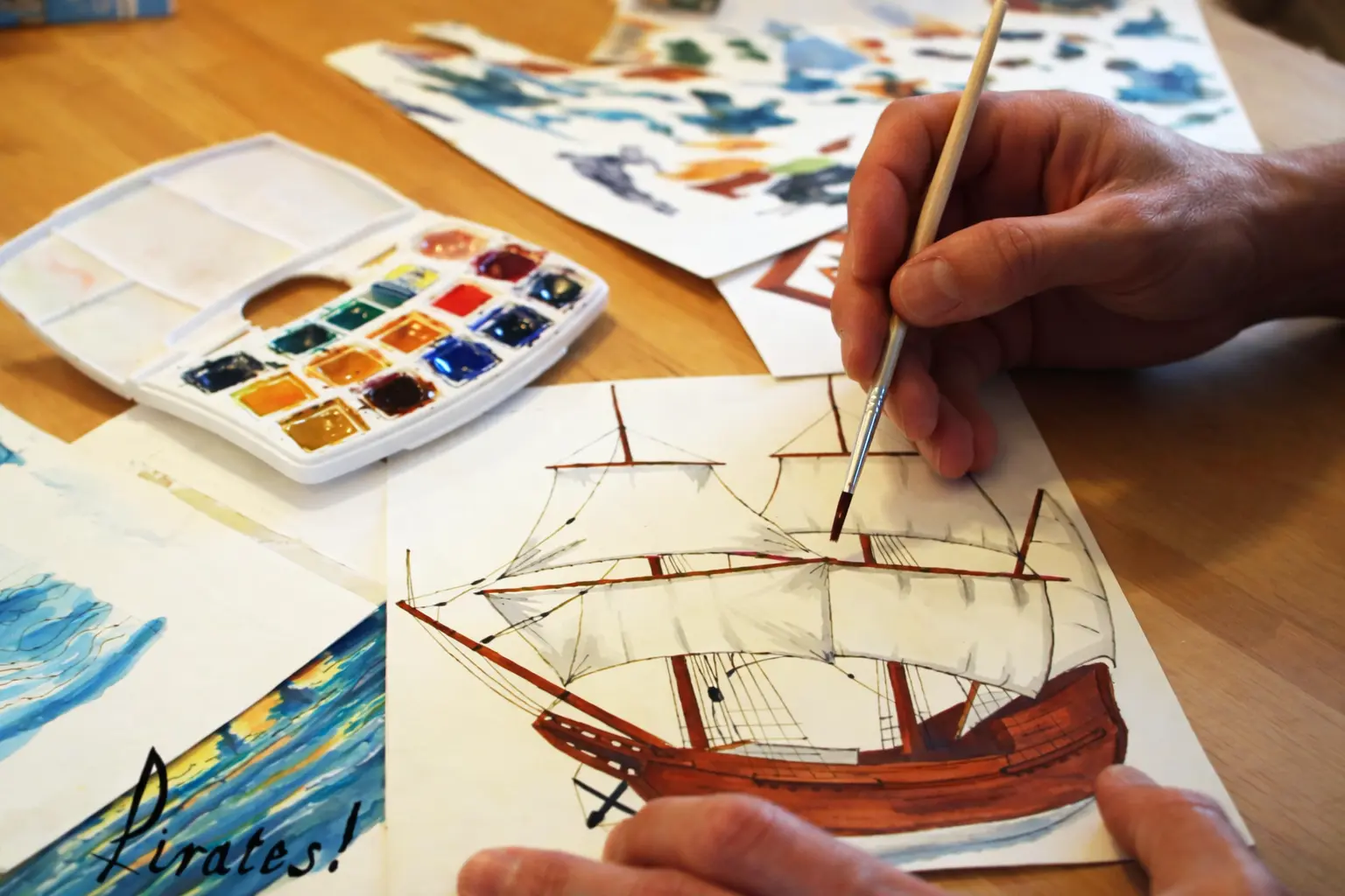 Painting the original Pirates ship artwork by hand with watercolour